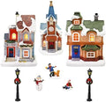 MOMENTS IN TIME Christmas Village Set 12-Piece with LED Lights Miniature Christmas Houses Lighted Holiday Décor for Tabletop Mantel Village Display Gift-Ready Packaging