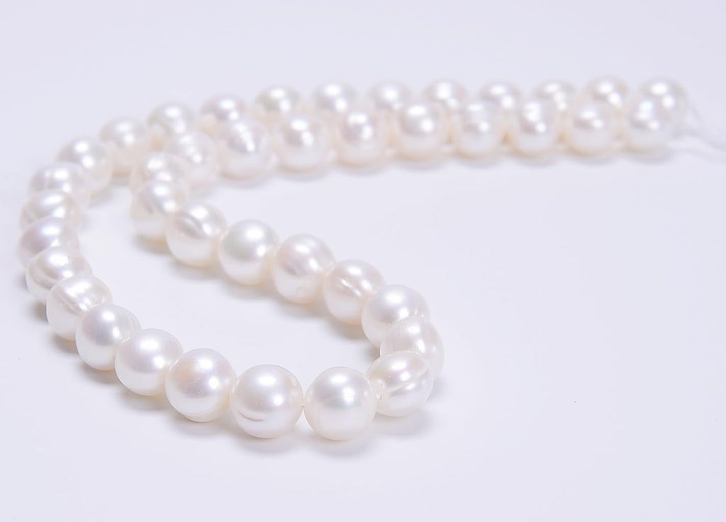 ad beads natural freshwater white pearl round beads shown in use
