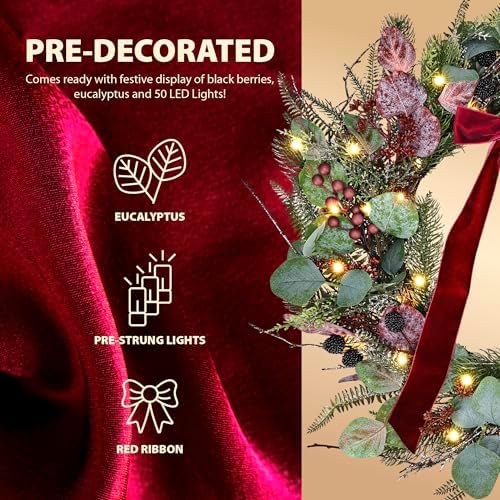 24 Inch Pre-Lit Artificial Christmas Wreath for Front Door Welcome - Realistic Frosted Eucalyptus Black Berries Red Velvet Bow - 50 LED Battery Operated Timer for Indoor Outdoor Modern Farmhouse