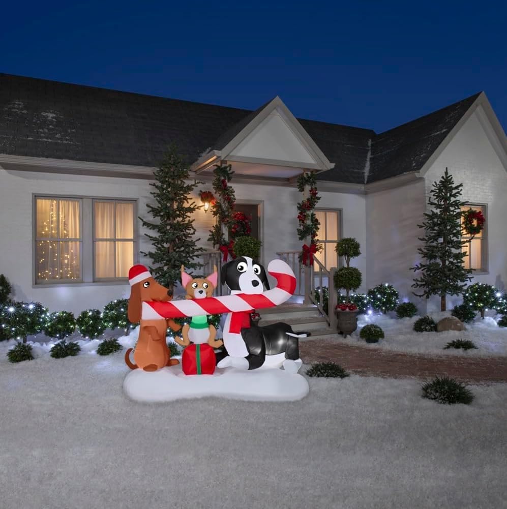 gemmy christmas inflatable dogs sharing a candy cane shown in use