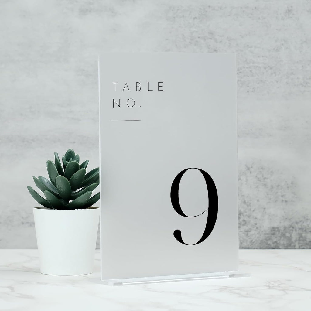 jinmury frosted wedding table numbers 1-10 with stands on a desk or shelf