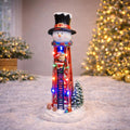Moments in Time Christmas Snowman Water Tower 12.44”H LED Lights Hand-Painted Polyresin Santa Climbing Scene Battery Operated Christmas Village Decoration Winter Holiday Display