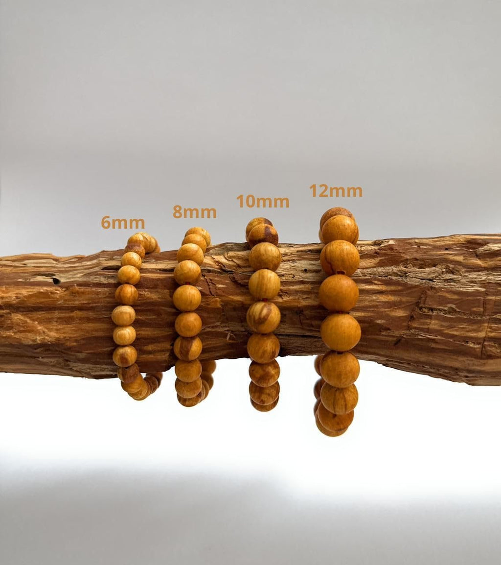 palo santo round beads – 100 count – shown in use