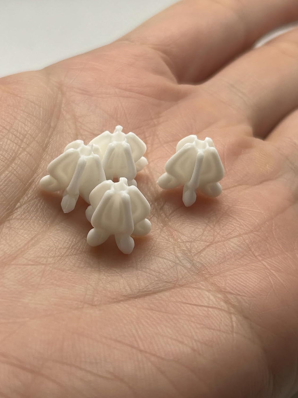 small plastic crown flower beads for jewelry making, close-up detail