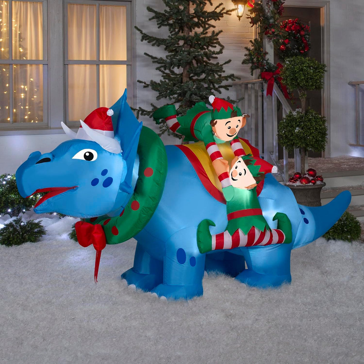 gemmy christmas inflatable triceratops with elves, 4.5 ft shown in use