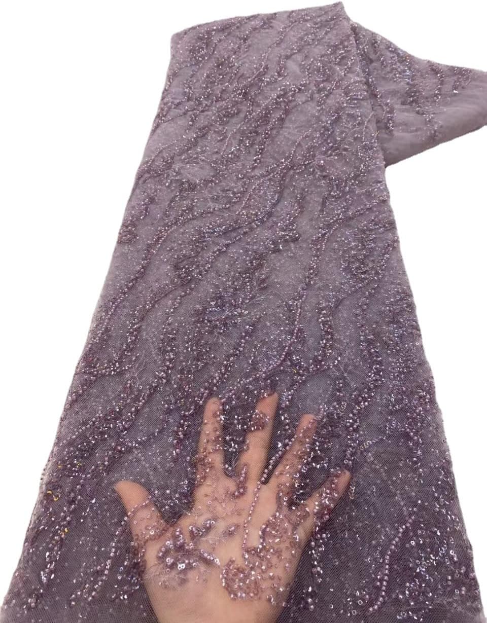 embroidered sequin african lace heavy craft beading glitter on a desk or shelf