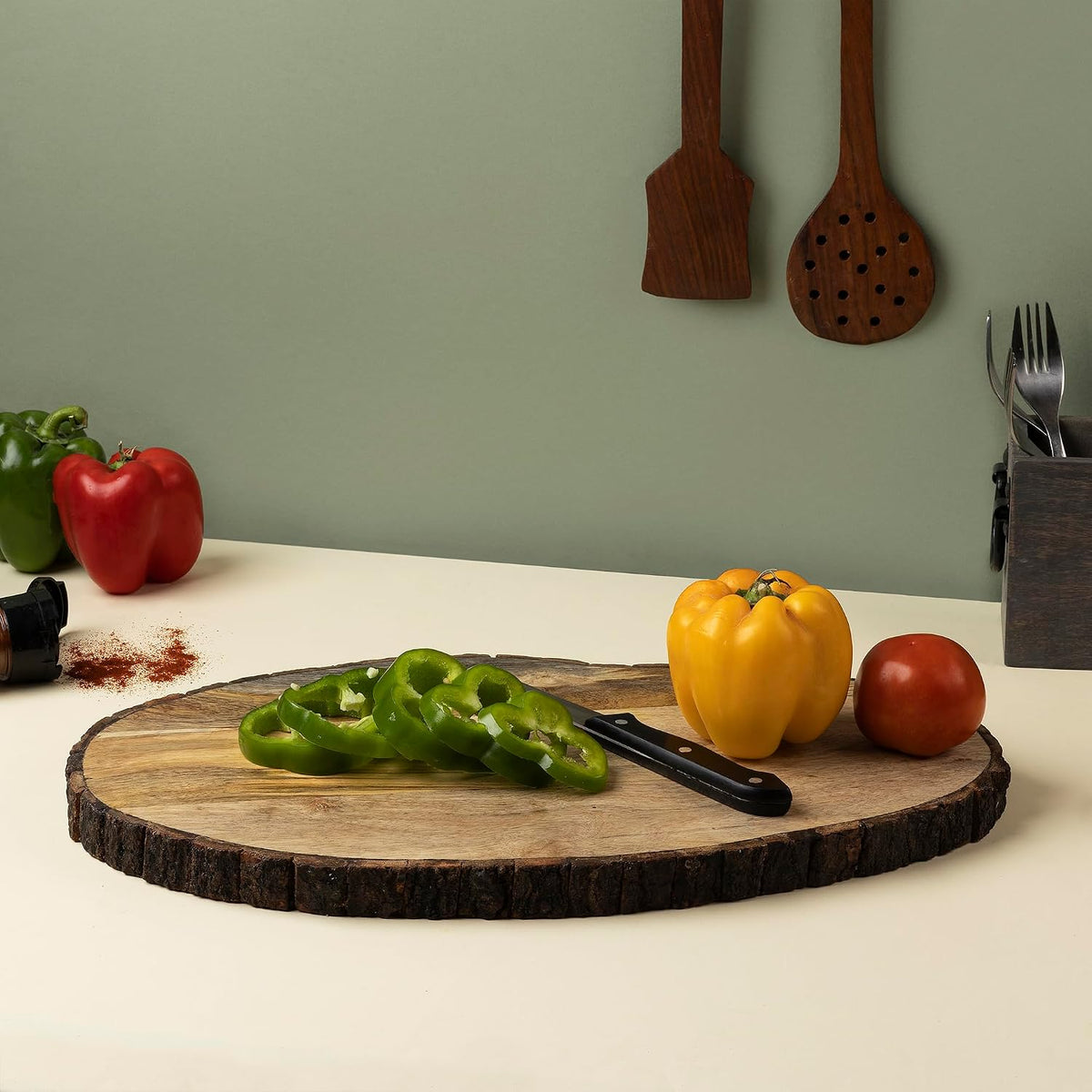 gocraft oval wooden cutting board with tree bark shown in use