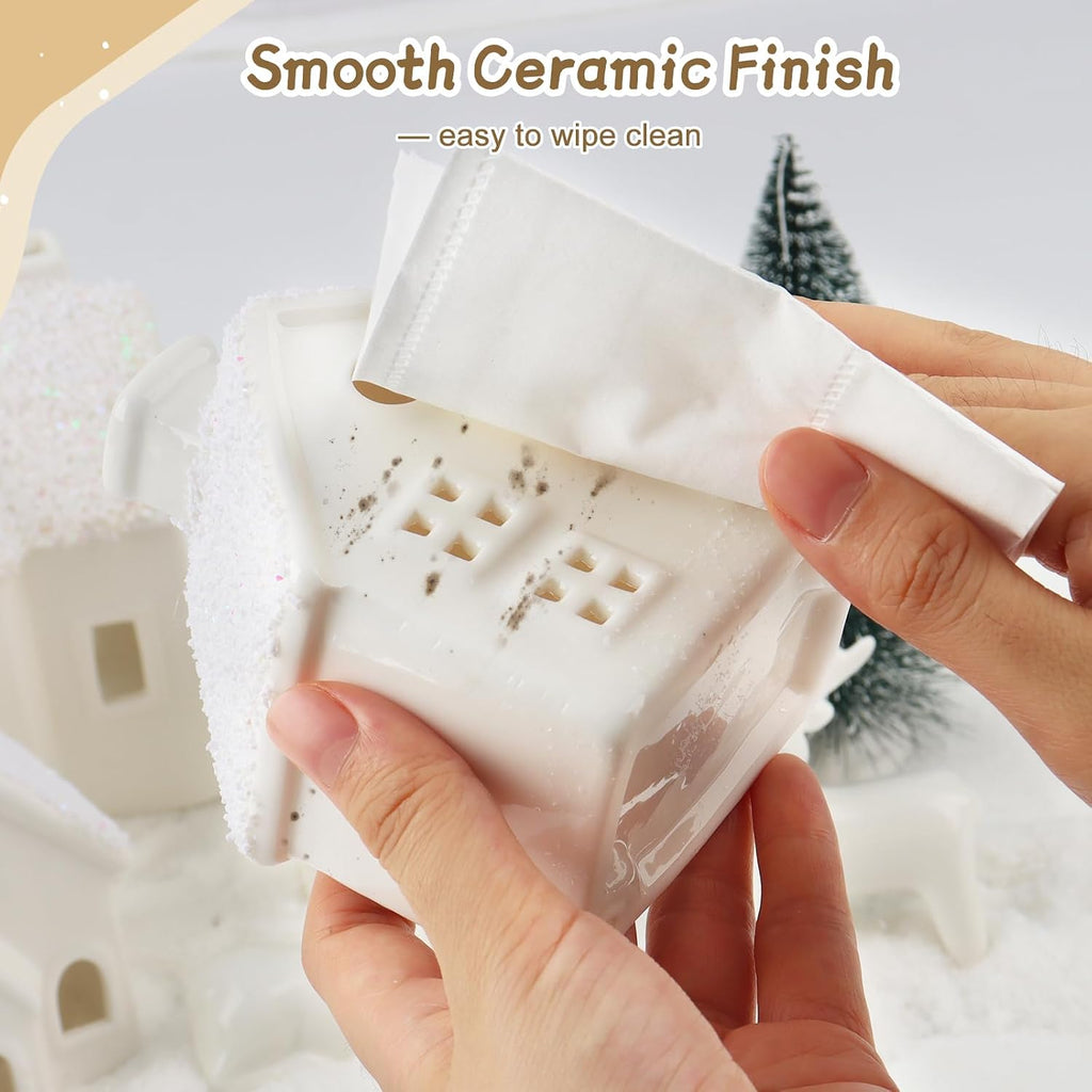 christmas village sets,4 ceramic houses with led lights on a desk or shelf