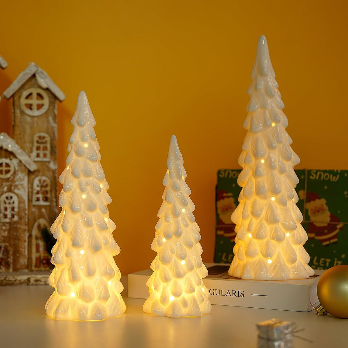 white ceramic christmas trees with lights, table top shown in use