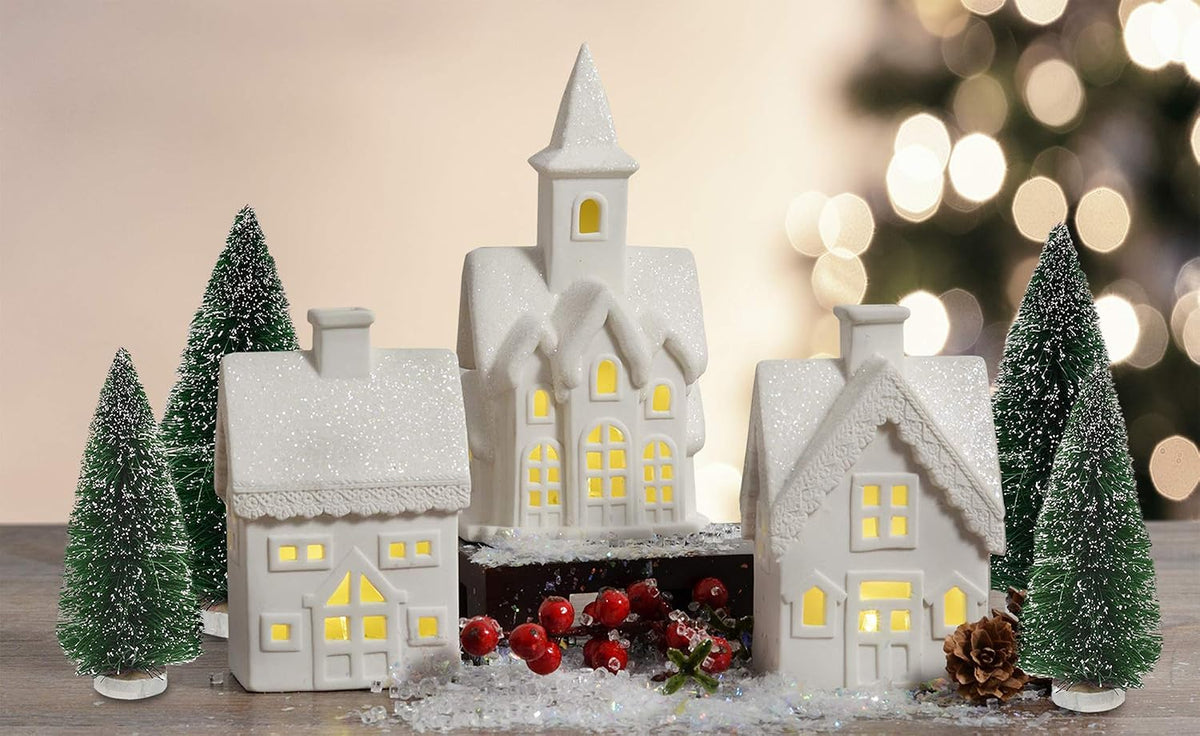 mark feldstein white porcelain christmas village figurines, 7 shown in use