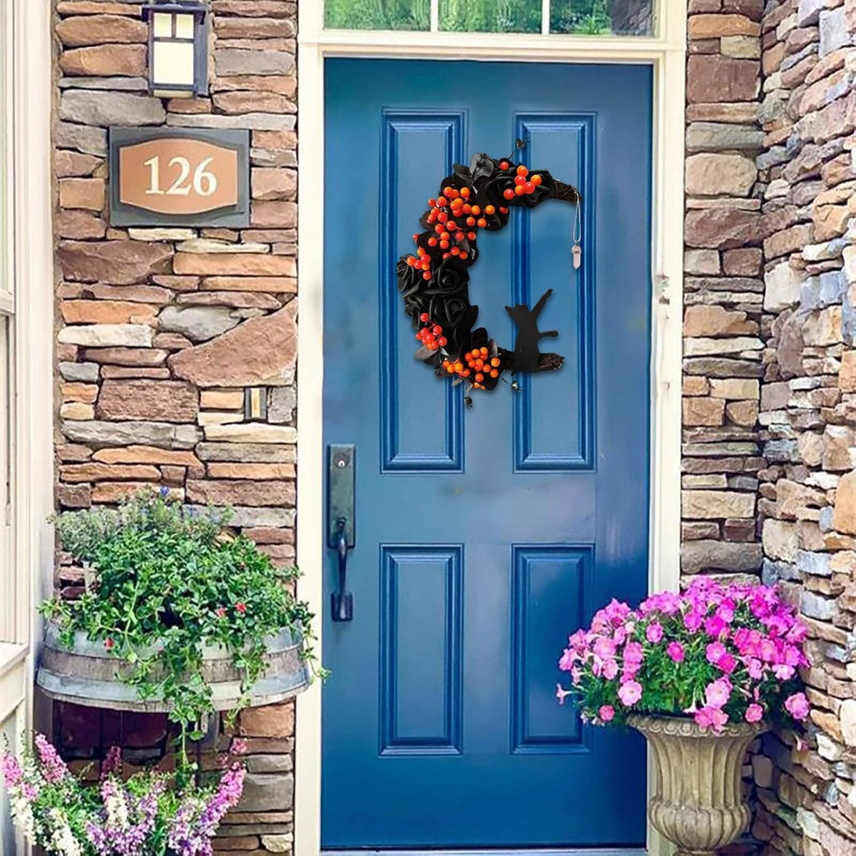 orange halloween wreath with lights, crescent moon cat, close-up detail