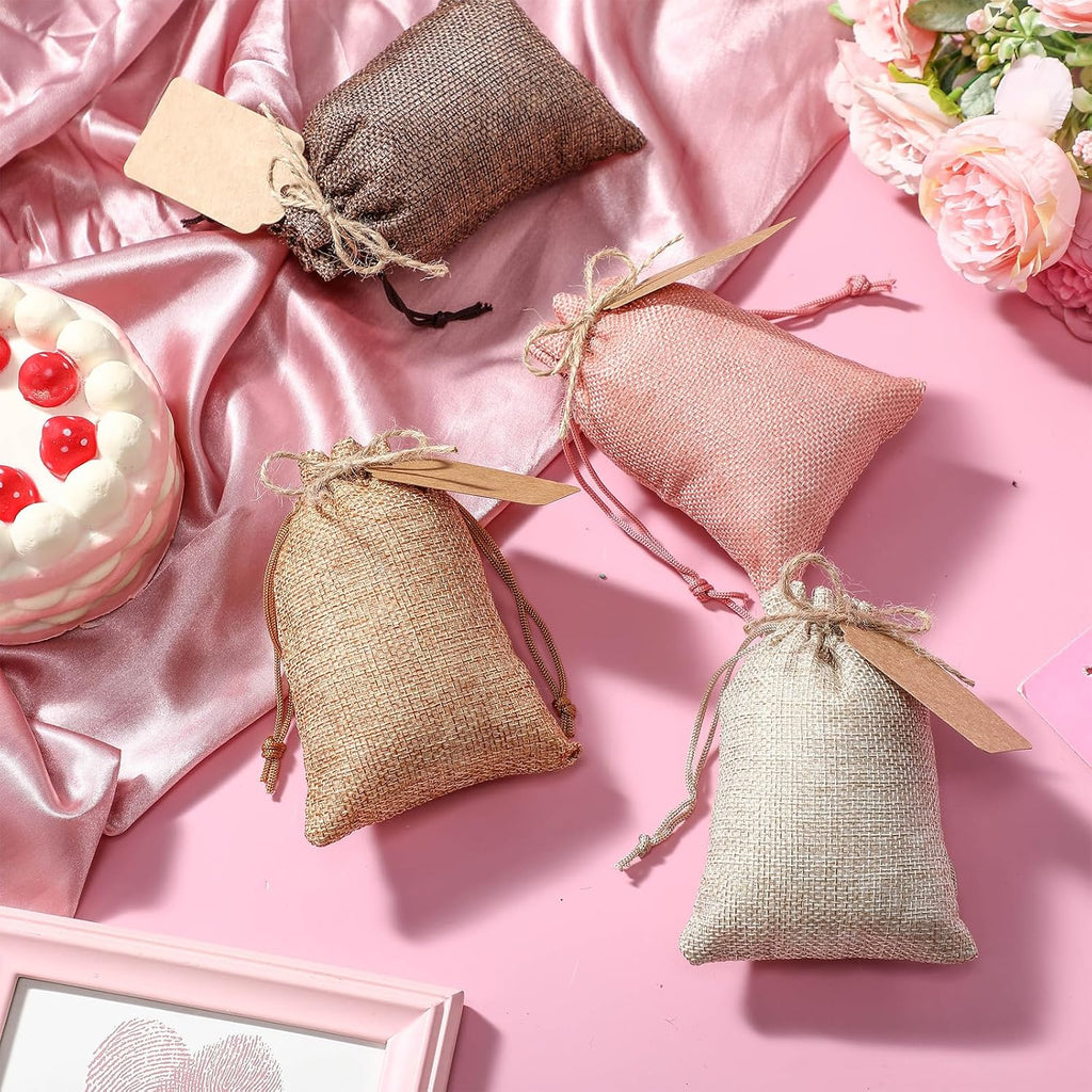 woanger 100 pcs drawstring burlap gift bags 4x6'' on a desk or shelf