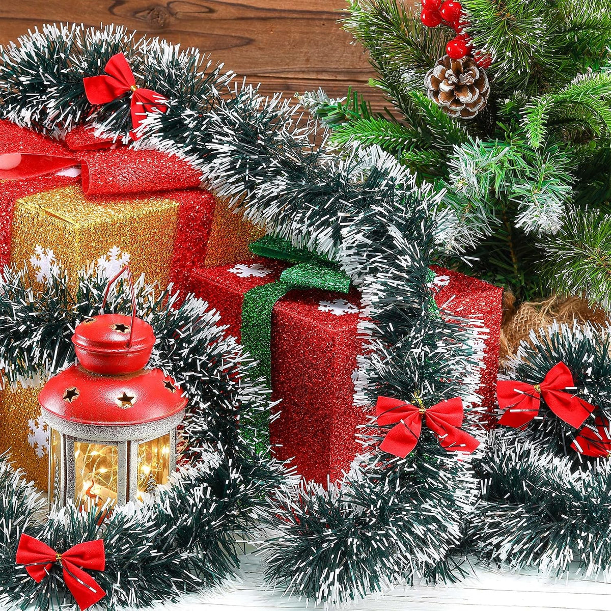 150ft christmas tinsel garland with 38 red bows on a desk or shelf
