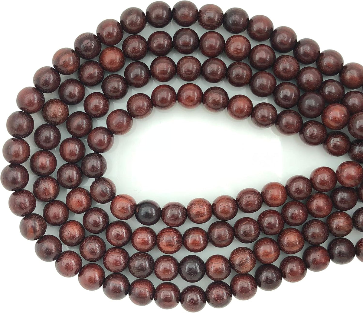 carpenterc round polished wood beads, blood sandalwood, 8mm shown in use