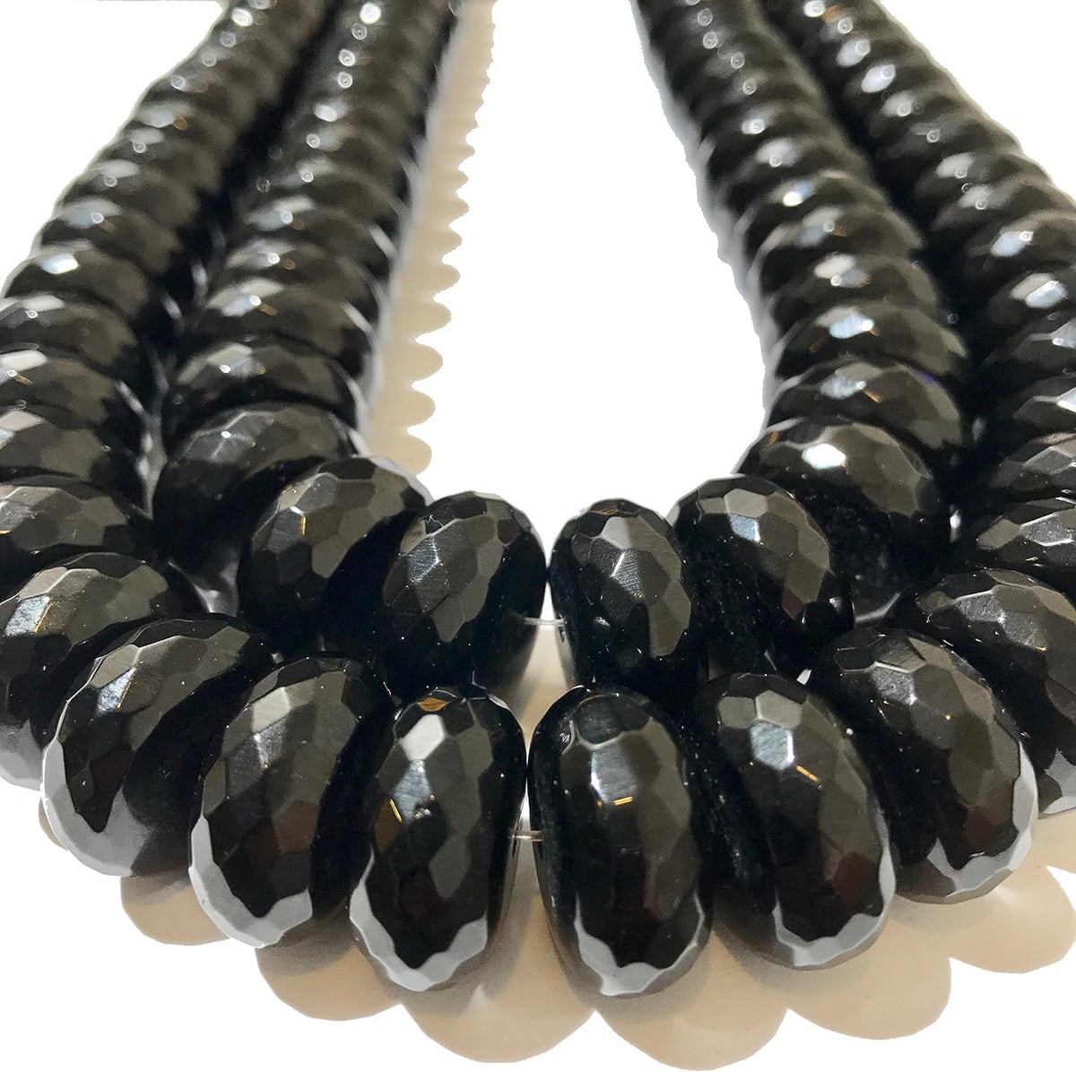 abcgems xl rio-grande black onyx beads brazil faceted shown in use