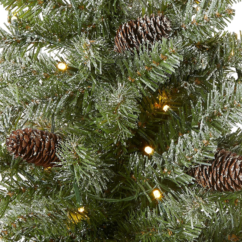 national tree company 2ft pre-lit flocked mini artificial shown in use