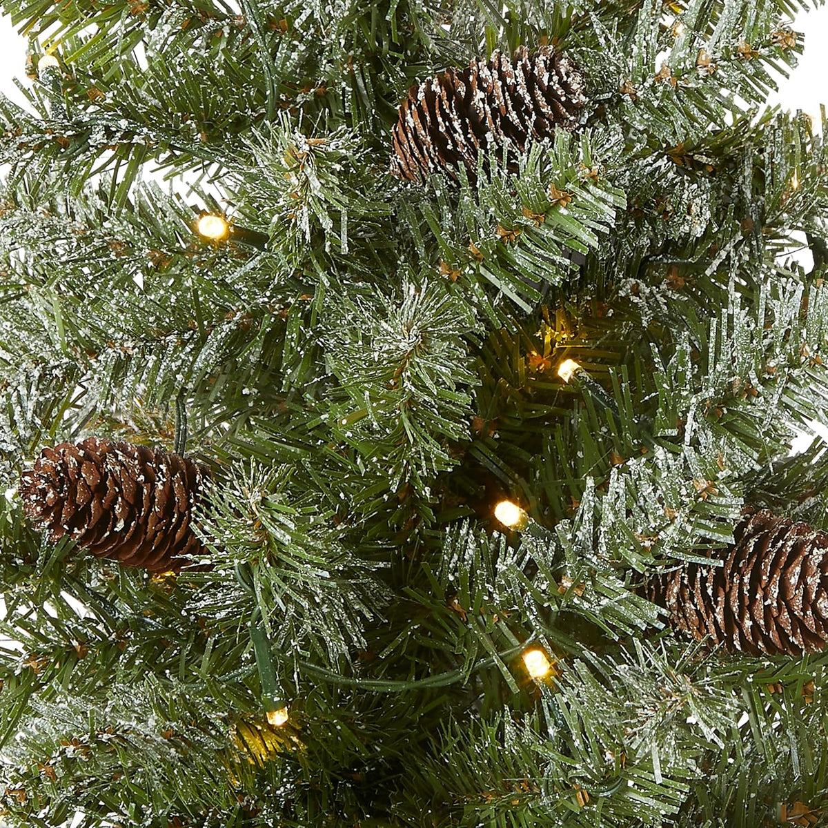 national tree company 2ft pre-lit flocked mini artificial shown in use